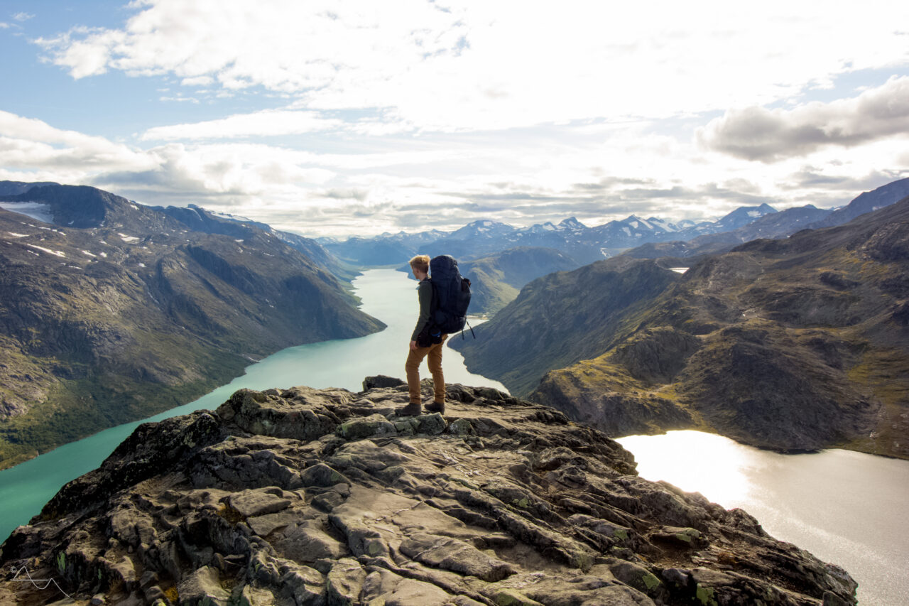 person standing on bessemgem ridge in jotunheimen norway