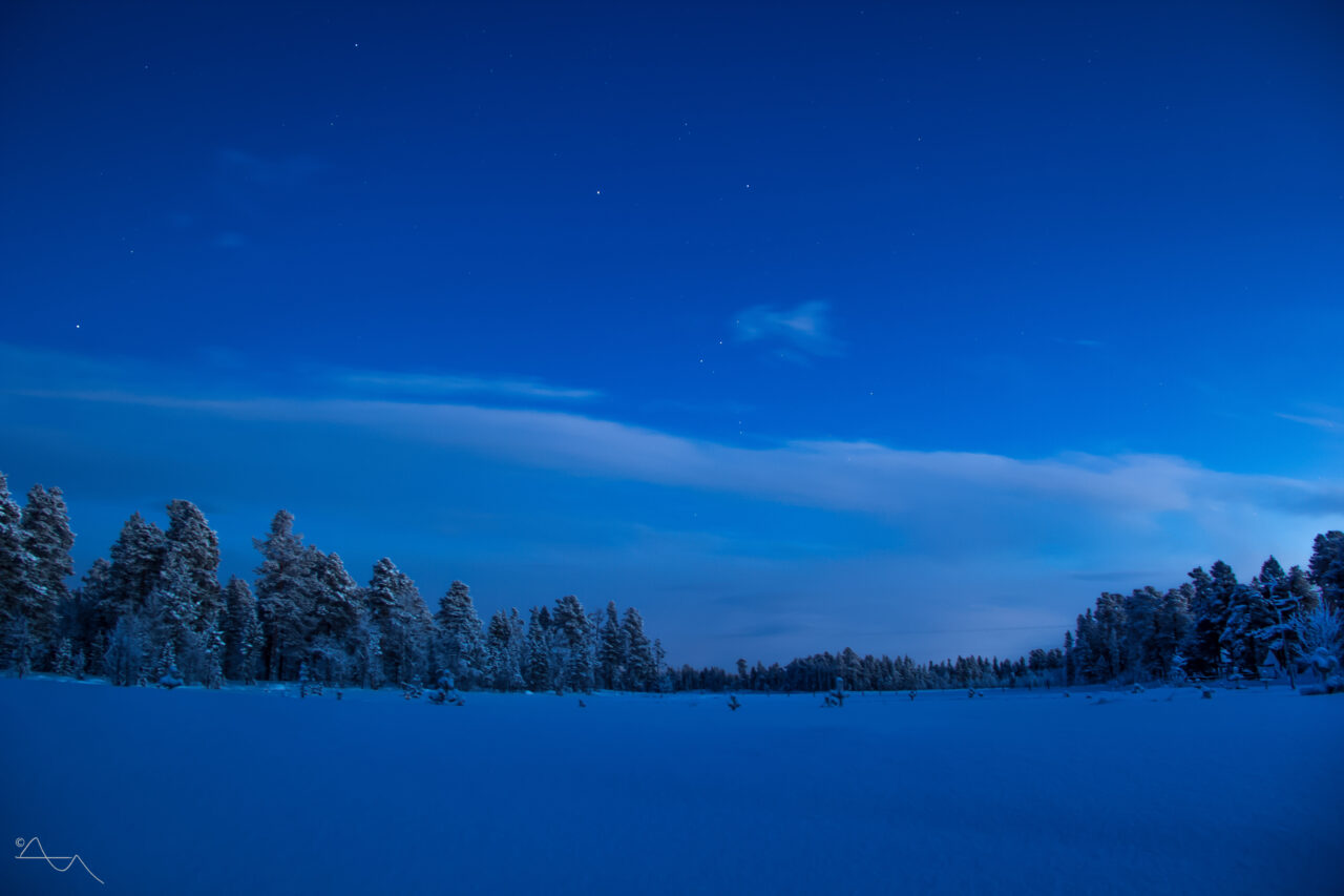 stars above snowy landscape in inari lapland