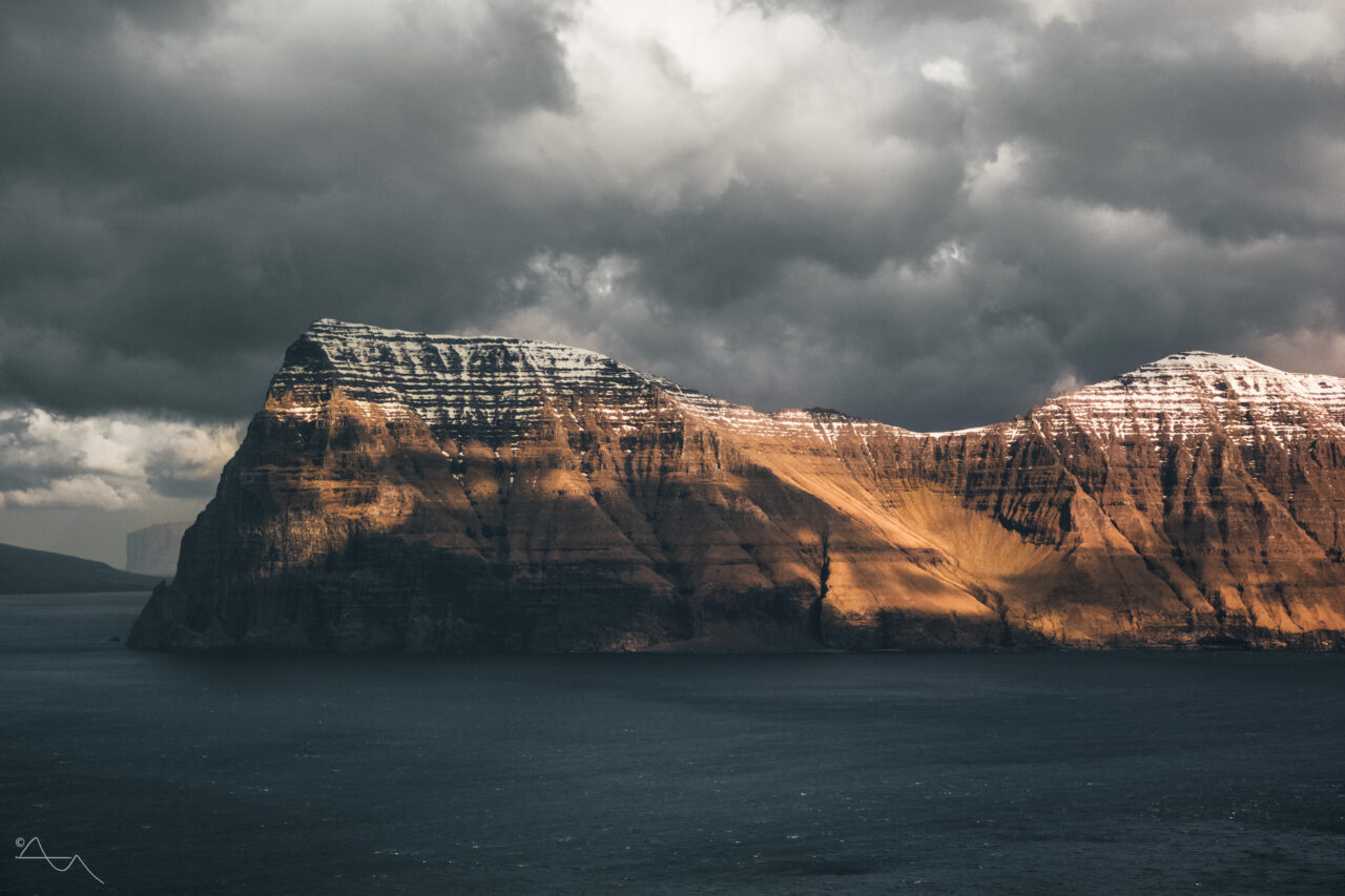snowy mountaintops of kunoy faroe islands